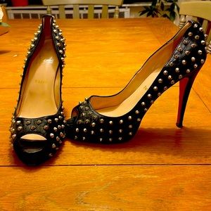 Used Louboutin leather studded accent pumps, good condition. Size 40.